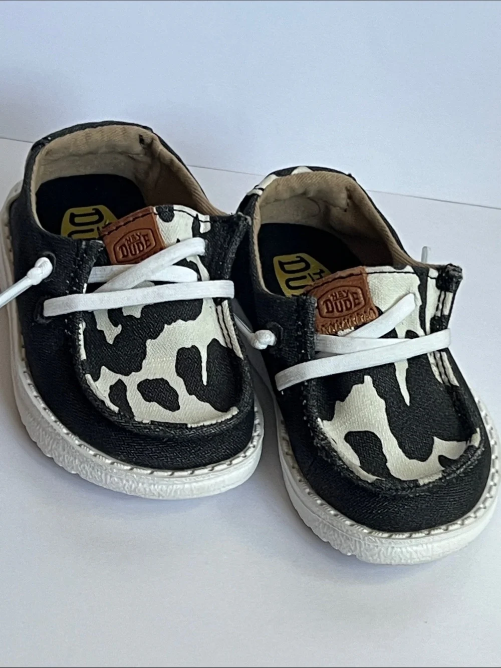 Hey Dude Wendy Black and White Cow Print Slip-On Loafers